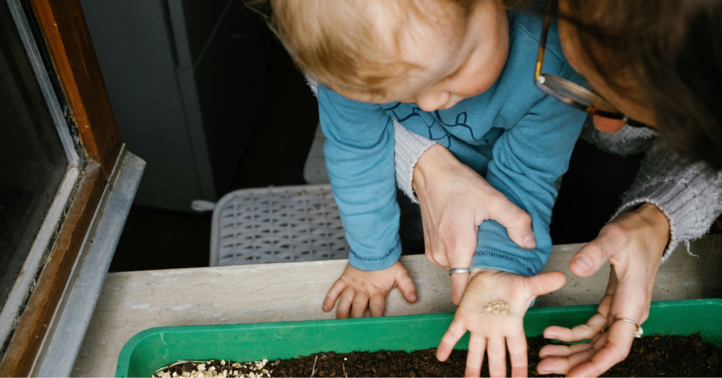 photo of mother and child planting seeds
